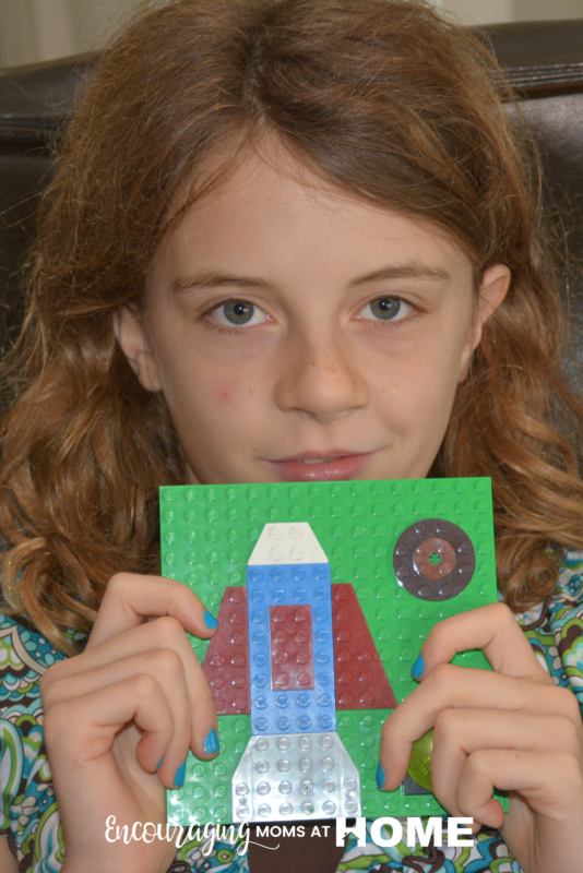 Anna, age ten, displays her LEGO Art.