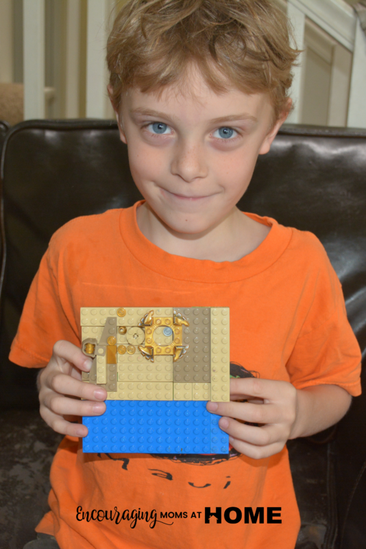 Caleb (age six) displays his LEGO Art.